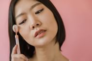 Face rollers may reduce dark circles. (Photo via Pexels/RDNE Stock project)